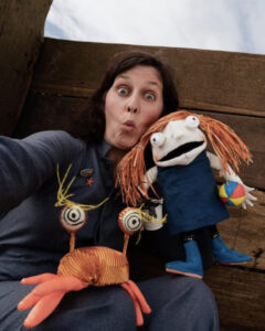Woman with Stinky McFish puppet show